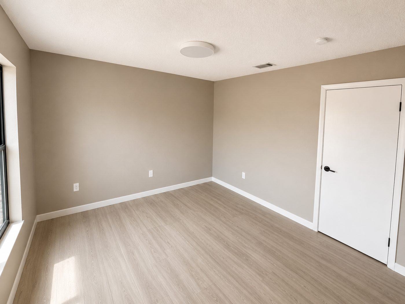 Freshly repainted bedroom with new flooring